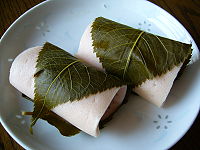 200px-A_rice_cake_filled_with_sweet_bean_paste_and_wrapped_in_a_pickled_cherry_leaf,katori-city,japan.jpg